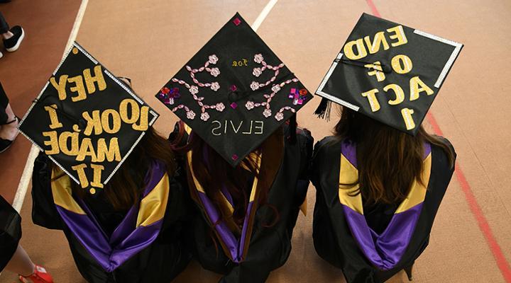 top look at decorated graduation caps on current graduates
